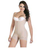 Woman wearing a beige shapewear bodysuit on a white background