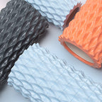 Four foam rollers in black, blue, and orange on a light gray background