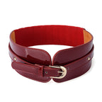 Red belt with gold buckle on a white background