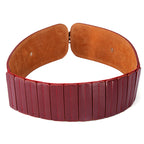 Wide belt with brown leather buckle and red leather strap on a white background
