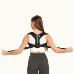 Person wearing a black posture corrector on a white background