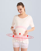 Woman wearing a pink abdominal support belt with a light gray background
