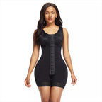 Woman wearing a black shapewear bodysuit on a white background