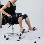 Person using a foot pump attached to an office chair on a plain background