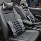 Car interior with massage seat cushion and headrest covers in a cityscape background