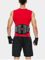 Person wearing a red tank top and black shorts with a black waist trainer on a white background