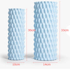 Two light blue textured vases with dimensions indicated on a white background