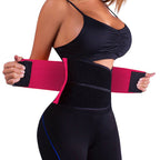 Person wearing a black waist trainer with pink straps on a white background
