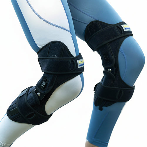 Person wearing protective knee and shin guards with a blurred natural background