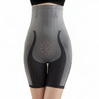 Gray and black compression shorts with a subtle pattern on a neutral background