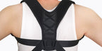 Person wearing a black posture corrector on a white background
