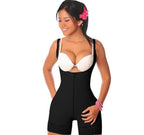 Woman wearing a black shapewear garment on a white background
