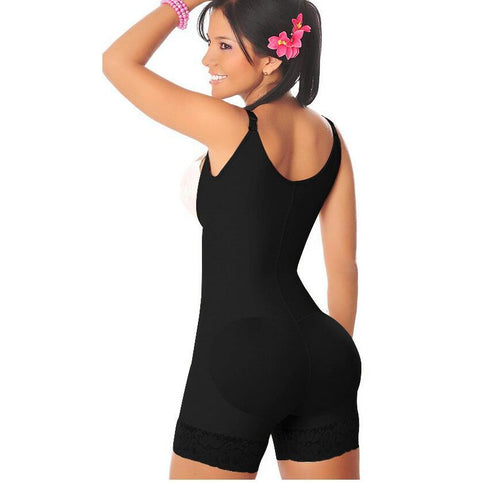 Woman wearing a black bodysuit on a white background
