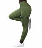Green leggings worn by a person on a white background