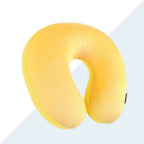 Yellow U-shaped neck pillow on a light gray background