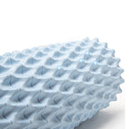 Textured blue foam roller on a white background