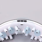 Close-up of a device with magnets and massage elements on a gray background