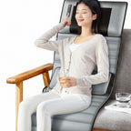 Woman using a massage mat in a home setting