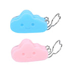 Two cloud-shaped keychains, one blue and one pink, on a white background.