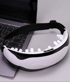 Eye massager on a desk with laptop, featuring text about its features.